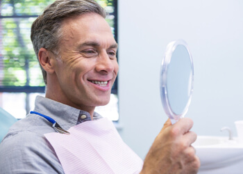 summing up bridge or implant for front tooth sydney
