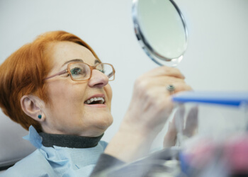 options bridge for teeth vs implant sydney