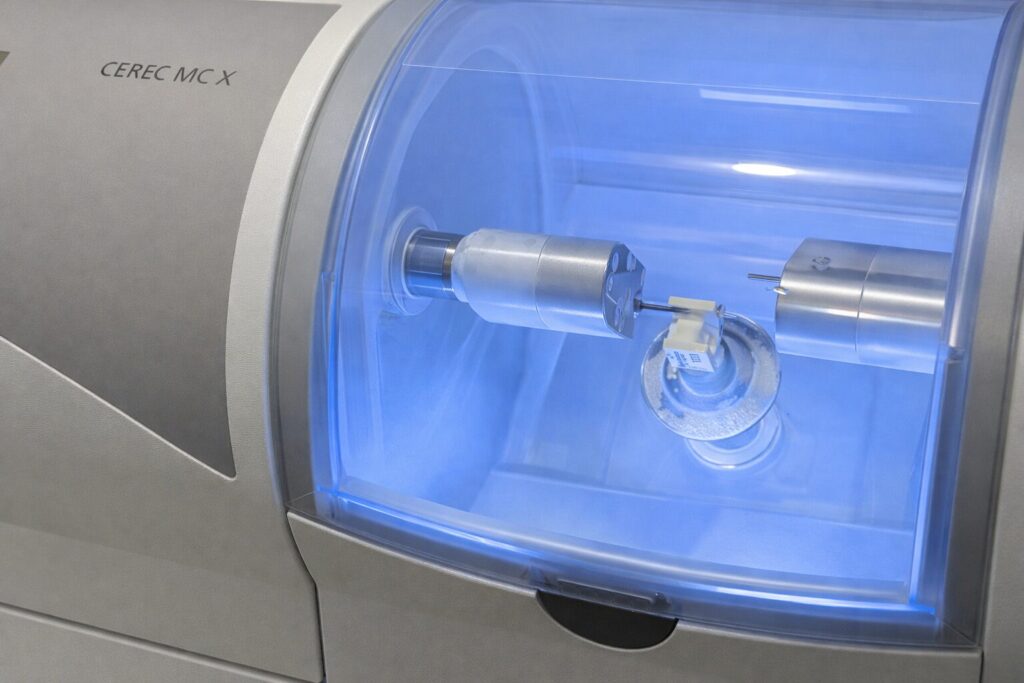 CEREC milling machine producing a same-day dental crown at a No Gaps Dental Sydney clinic